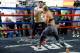 GLENDALE, CA - JULY 15: Former boxer Mike Tyson and UFC president Dana White watch UFC Bantamweight champion Ronda Rousey as she spars with trainer Edmond Tarverdyan during a media training session at the Glendale Fight Club on July 15, 2015 in Glendale,