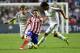 Atletico Madrid's midfielder and captain Gabi (C) vies with Real Madrid's Portuguese defender Fabio Coentrao (L) and Real Madrid's German midfielder Sami Khedira during the UEFA Champions League Final Real Madrid vs Atletico de Madrid at Luz stadium in Li
