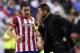 Atletico Madrid's Argentinian coach Diego Simeone (R) gives instructions to Atletico Madrid's midfielder and captain Gabi during the UEFA Champions League Final Real Madrid vs Atletico de Madrid at Luz stadium in Lisbon, on May 24, 2014. AFP PHOTO/ JAVI