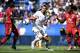 Paris Saint-Germain's Swedish forward Zlatan Ibrahimovic (C) vies with Lyon's French Burkinabe defender Bakary Kone (R) and Lyon's French Cameroonian defender Samuel Umtiti during the French Trophy of Champions football match at Saputo stadium in Montreal