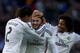 MADRID, SPAIN - JANUARY 31: Karim Benzema (2nd L) of Real Madrid CF celebrates scoring their fourth goal with team-mates Raphael Varane (L) and Marcelo (R) during the La Liga match between Real Madrid CF and Real Sociedad de Futbol at Estadio Santiago Be