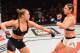 RIO DE JANEIRO, BRAZIL - AUGUST 01: (L-R) Ronda Rousey of the United States throws a punch at Bethe Correia of Brazil in their UFC women's bantamweight championship bout during the UFC 190 event inside HSBC Arena on August 1, 2015 in Rio de Janeiro, Braz