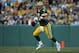 GREEN BAY, WI - AUGUST 19: Quaterback Brett Favre #4 of the Green Bay Packers scrambles with the ball during the preseason game against the Atlanta Falcons on August 19, 2006 at Lambeau Field in Green Bay, Wisconsin. The Packers won 38-10. (Photo by Jona