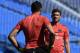 Paris Saint-Germain's French goalkeeper Nicolas Douchez (R) speaks with Italian goalkeeper Salvatore Sirigu during a training session at Saputo stadium in Montreal on July 31, 2015 on the eve of the French Trophy of Champions football match against Lyon.