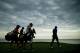 SHEBOYGAN, WI - AUGUST 13: Tiger Woods of the United States walks ahead of Martin Kaymer of Germany and their caddies on the 16th hole during the first round of the 2015 PGA Championship at Whistling Straits on August 13, 2015 in Sheboygan, Wisconsin. (