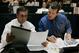 Coach Mike Shanahan and Ted Sundquist confer during the 2006 draft.