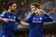 LONDON, ENGLAND - NOVEMBER 01: Oscar of Chelsea celebrates his goal with Cesc Fabregas during the Barclays Premier League match between Chelsea and Queens Park Rangers at Stamford Bridge on November 1, 2014 in London, England. (Photo by Mike Hewitt/Gett
