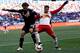 HARRISON, NJ - MARCH 22: Nick DeLeon #14 of D.C. United battles for the ball with Sal Zizzo #15 of New York Red Bulls during their match at Red Bull Arena on March 22, 2015 in Harrison, New Jersey. (Photo by Jeff Zelevansky/Getty Images)