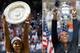 Serena Williams poses with trophies from Wimbledon (2015) and the U.S. Open (2014).