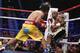Floyd Mayweather Jr. exchange punches with Manny Pacquiao during their welterweight unification championship bout, May 2, 2015 at MGM Grand Garden Arena in Las Vegas, Nevada. Mayweather defeated Pacquiao by unanimous decision. AFP PHOTO / JOHN GURZINKSI