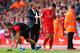 LIVERPOOL, ENGLAND - AUGUST 29: Philippe Coutinho of Liverpool is consoled by Brendan Rodgers, manager of Liverpool after receiving a red card during the Barclays Premier League match between Liverpool and West Ham United at Anfield on August 29, 2015 in