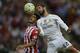 Sporting Gijon's midfielder Nacho Cases (L) vies with Real Madrid's midfielder Isco during the Spanish league football match Sporting Gijon vs Real Madrid CF at the El Molinon stadium in Gijon on August 23, 2015. AFP PHOTO/ MIGUEL RIOPA (Photo cr