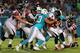 MIAMI GARDENS, FL - AUGUST 29: Matt Ryan #2 of the Atlanta Falcons is sacked by Cameron Wake #91 and Ndamukong Suh #93 of the Miami Dolphins during a preseason game at Sun Life Stadium on August 29, 2015 in Miami Gardens, Florida. (Photo by Mike Ehrman