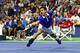 NEW YORK, NY - SEPTEMBER 13: Novak Djokovic of Serbia misses a backhand shot against Roger Federer of Switzerland during their Men's Singles Final match on Day Fourteen of the 2015 US Open at the USTA Billie Jean King National Tennis Center on September