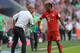 Bayern Munich's Spanish headcoach Pep Guardiola (L) talks to Bayern Munich's new French defender Kingsley Coman (R) during the German first division Bundesliga football match FC Bayern Munich v FC Augsburg, in Munich, on September 12, 2015. AFP PHOTO /CH