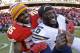 Brandon Flowers is embraced by former teammates Jamaal Charles.