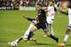 Aug 1, 2015; Washington, DC, USA; D.C. United forward Fabian Espindola (10) dribbles the ball past Real Salt Lake midfielder Luis Gil (10) during the second half at Robert F. Kennedy Memorial. D.C. United won 6 - 4. Mandatory Credit: Brad Mills-USA TODAY