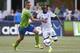 Aug 1, 2015; Seattle, WA, USA; Vancouver Whitecaps midfielder Kekuta Manneh (23) gets past Seattle Sounders FC defender Dylan Remick (15) during the first half at CenturyLink Field. Vancouver defeated Seattle, 3-0. Mandatory Credit: Joe Nicholson-USA TODA