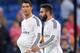 MADRID, SPAIN - OCTOBER 05: Cristiano Ronaldo of Real Madrid leaves the pitch with the ball under his shirt beside Daniel Carvajal after scoring a hat trick in his team's 5-0 victory over Athletic Club during the La Liga match between Real Madrid CF and