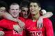 YOKOHAMA, JAPAN - DECEMBER 21: Wayne Rooney (L) of Manchester United celebrates their first goal with teammates Chrsitiano Ronaldo (R) and Michael Carrick (C) during the FIFA Club World Cup Final match between Manchester United and Liga de Quito at the I