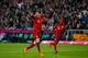 MUNICH, GERMANY - SEPTEMBER 22: Robert Lewandowski (L) of Bayern Munich celebrates after scoring his 5th goal during the Bundesliga match between FC Bayern Muenchen and VfL Wolfsburg at Allianz Arena on September 22, 2015 in Munich, Germany. (Photo by B