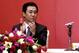 World Cup-winning coach Marcello Lippi (R) stands up as Guangzhou Evergrande's chairman Xu Jiayin (L) claps during a signing ceremony in Guangzhou, southern China's Guangdong province on May 17, 2012. China's Guangzhou Evergrande announced they had signe