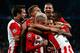 EINDHOVEN, NETHERLANDS - SEPTEMBER 15: PSV Eindhoven players celebrate the goal scored by Hector Moreno #3 during the UEFA Champions League Group B match between PSV Eindhoven and Manchester United at PSV Stadion on September 15, 2015 in Eindhoven, Nethe