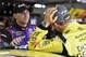 As the end neared, Denny Hamlin (left) and Matt Kenseth kept the pressure on Kevin Harvick.