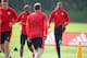 Ashley Young appears amused by Martial in training