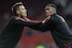 Morgan and Martial, either warming up or performing interpretive dance