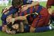 Barcelona's Uruguayan forward Luis Suarez (bottom) celebrates a goal with teammates during the UEFA Champions League football match FC Barcelona vs Bayer Leverkusen at the Camp Nou stadium in Barcelona on September 29, 2015. AFP PHOTO / LLUIS GENE