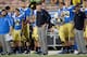 UCLA HC Jim Mora (center)