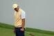 Oct 5, 2013; Dublin, OH, USA; Adam Scott reacts to his putt on the 16th green during the second round of the Presidents Cup at Muirfield Village Golf Club. Mandatory Credit: Allan Henry-USA TODAY Sports
