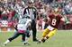 Oct 4, 2015; Landover, MD, USA; Washington Redskins quarterback Kirk Cousins (8) runs with the ball as Philadelphia Eagles strong safety Walter Thurmond (26) chases in the fourth quarter at FedEx Field. The Redskins won 23-20. Mandatory Credit: Geoff Burk