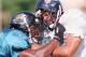 STEVENS POINT, WI - JULY 20: Linebacker Mark Williams (L) of the NFL expansion Jacksonville Jaguars locks up with tight end Carlos Etheredge during training camp hitting drills 20 July at the University of Wisconsin-Stevens Point campus. The Jaguars will