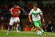 MANCHESTER, ENGLAND - SEPTEMBER 30: Max Kruse of VfL Wolfsburg is chased by Luis Antonio Valencia of Manchester United during the UEFA Champions League Group B match between Manchester United FC and VfL Wolfsburg at Old Trafford on September 30, 2015 in
