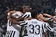 TURIN, ITALY - OCTOBER 04: Paulo Dybala (C) of Juventus FC celebrates his goal with team mates during the Serie A match between Juventus FC and Bologna FC at Juventus Arena on October 4, 2015 in Turin, Italy. (Photo by Valerio Pennicino/Getty Images)