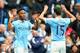 MANCHESTER, ENGLAND - OCTOBER 17: Raheem Sterling of Manchester City celebrates scoring his team's fourth and hat trick goal with his team mates during the Barclays Premier League match between Manchester City and A.F.C. Bournemouth at Etihad Stadium on