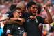 STOKE ON TRENT, ENGLAND - AUGUST 09: Philippe Coutinho of Liverpool (10) celebrates with team mates Martin Skrtel and Emre Can as he scores their first goal during the Barclays Premier League match between Stoke City and Liverpool at Brittania Stadium on