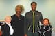 Roosevelt Barnes and Caleb Swanigan pose with their lawyer (left) and the magistrate who oversaw the case (right) on the day the adoption was finalized.