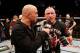 LAS VEGAS, NV - NOVEMBER 16: Georges St-Pierre (right) is interviewed by Joe Rogan (left) during the UFC 167 event inside the MGM Grand Garden Arena on November 16, 2013 in Las Vegas, Nevada. (Photo by Josh Hedges/Zuffa LLC/Zuffa LLC via Getty Images)