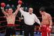 Minter (left) celebrates a victory during his professional career.
