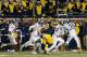 ANN ARBOR, MI - OCTOBER 17: Defensive back Jalen Watts-Jackson #20 of the Michigan State Spartans runs the football into to endzone for the game winning touchdown against the Michigan Wolverines during the final seconds of college football game at Michig