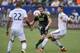 Oct 18, 2015; Carson, CA, USA; Portland Timbers forward Lucas Melano (center) attempts a shots defended by Los Angeles Galaxy defender Omar Gonzalez (right) during the first half at StubHub Center. Mandatory Credit: Kelvin Kuo-USA TODAY Sports