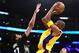 LOS ANGELES, CA - OCTOBER 28: Kobe Bryant #24 of the Los Angeles Lakers attempts a shot over Karl-Anthony Towns #32 of the Minnesota Timberwolves during the first quarter at Staples Center on October 28, 2015 in Los Angeles, California. NOTE TO USER: Us