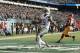 Jets wide receiver Brandon Marshall scores a touchdown against the Washington Redskins