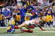 ST. LOUIS, MO - OCTOBER 13: Stevie Johnson #13 of the San Francisco 49ers makes a reception as Janoris Jenkins #21 of the St. Louis Rams defends during the game at the Edward Jones Dome on October 13, 2014 in St. Louis, Missouri. The 49ers defeated the Ra