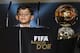 Cristiano Jr, son of Real Madrid and Portugal forward Cristiano Ronaldo, looks over the speech podium on stage as his fathers receives the 2014 FIFA Ballon d'Or award for player of the year during the FIFA Ballon d'Or award ceremony at the Kongresshaus in