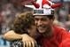 Manchester United's Portuguese midfielder Cristiano Ronaldo (R) gets a hug from his mother Delores Avero (L) after the 0-0 draw with Arsenal in the English Premier League football match at Old Trafford, Manchester, north-west England, on May 16, 2009.The