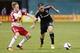 Nov 1, 2015; Washington, DC, USA; D.C. United forward Fabian Espindola (10) and New York Red Bulls midfielder Dax McCarty (11) battle for the ball in the second half of the first leg of the eastern conference semi-final at Robert F. Kennedy Memorial Stadi